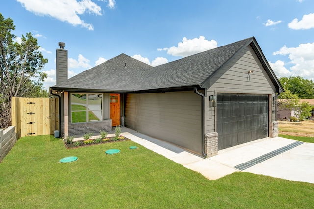 view of front facade with a garage and a front yard