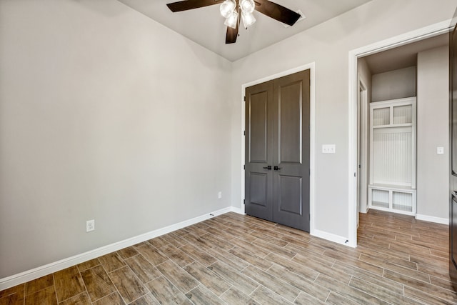 unfurnished bedroom featuring ceiling fan and light hardwood / wood-style flooring