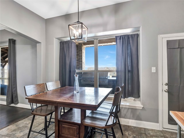 dining room featuring a chandelier and a wealth of natural light