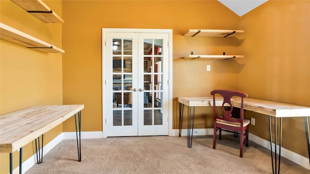 interior space with light carpet, french doors, and vaulted ceiling