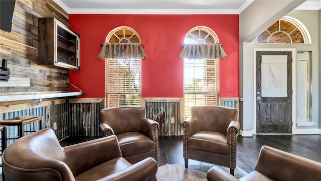 living room with crown molding and dark wood-type flooring