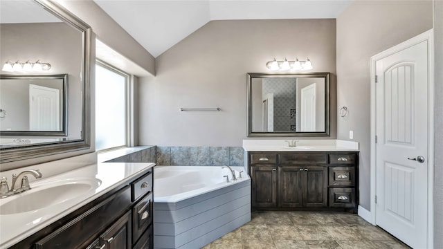 bathroom with separate shower and tub, vanity, and vaulted ceiling