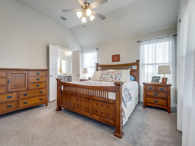 carpeted bedroom featuring connected bathroom, ceiling fan, and lofted ceiling