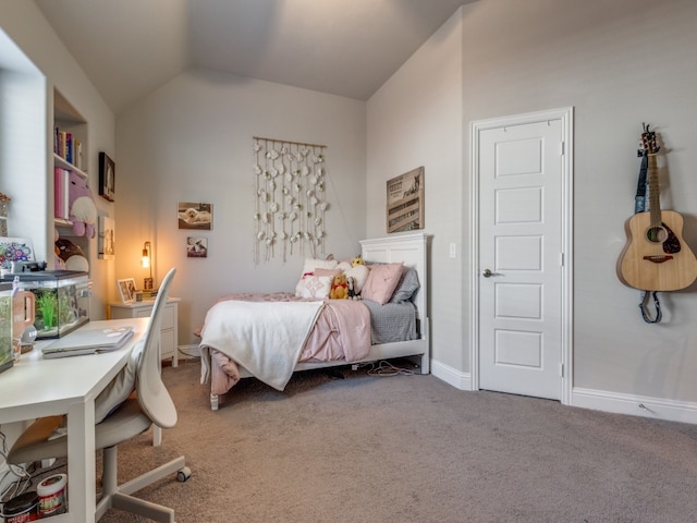 bedroom featuring carpet floors and lofted ceiling