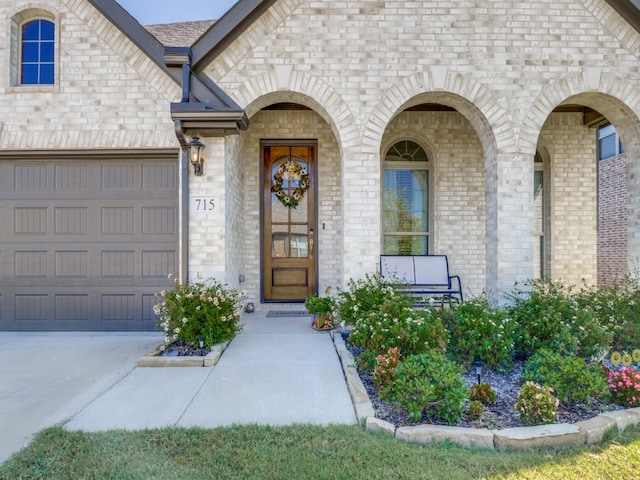 view of exterior entry with a garage