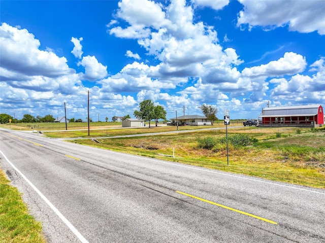 view of road with a pole building