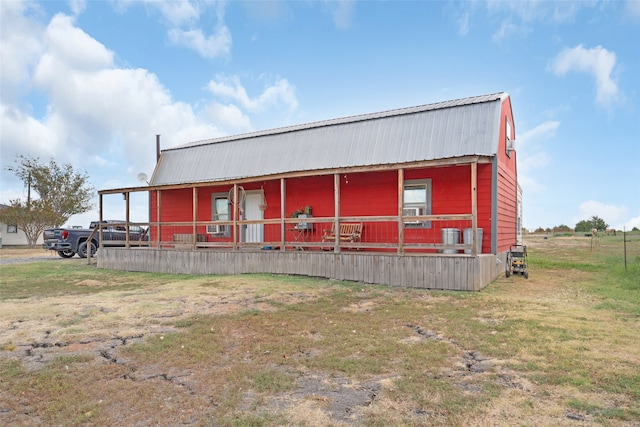 exterior space featuring a yard and a porch