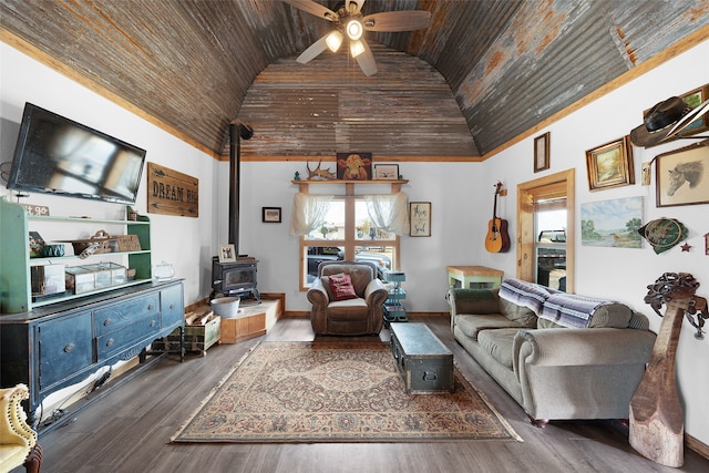 living room featuring a wood stove, ceiling fan, wood-type flooring, and wood ceiling