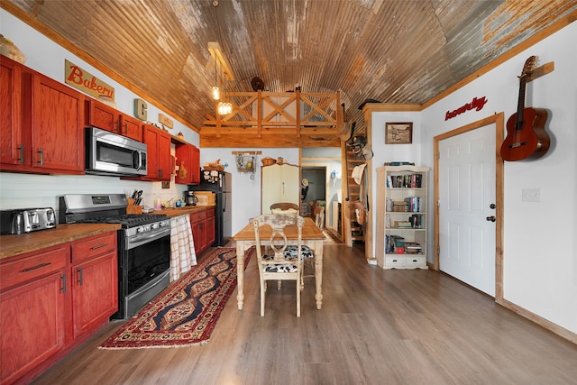 kitchen featuring wood ceiling, dark hardwood / wood-style floors, and appliances with stainless steel finishes