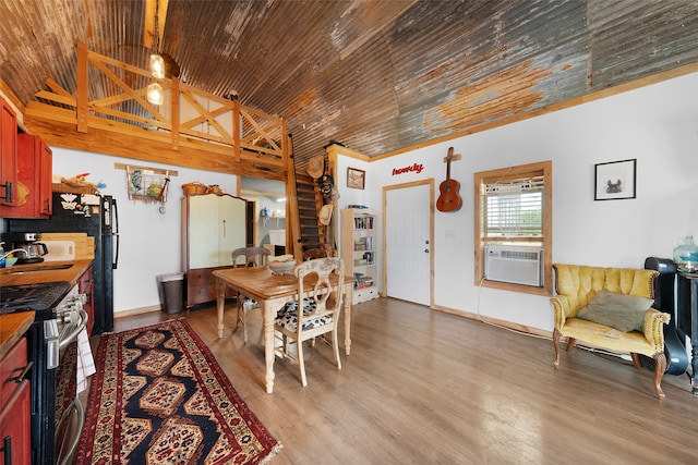 dining room featuring cooling unit and hardwood / wood-style floors