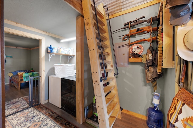 interior space with hardwood / wood-style flooring and independent washer and dryer