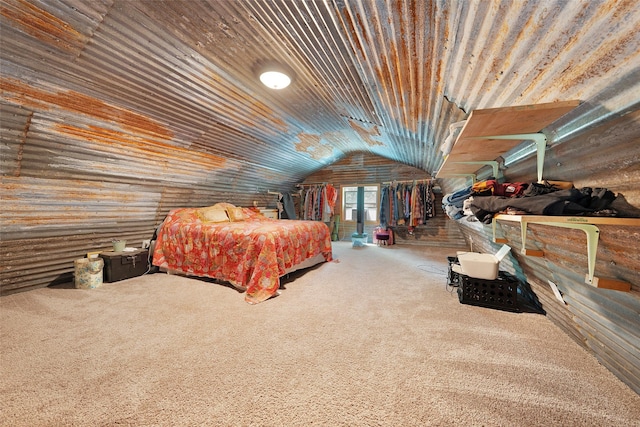 bedroom with carpet floors, wood walls, wood ceiling, and lofted ceiling