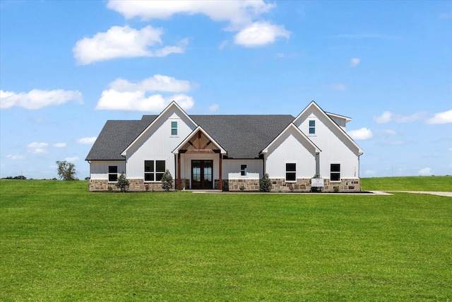 view of front facade with french doors and a front yard