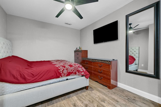 bedroom featuring light wood-type flooring and ceiling fan