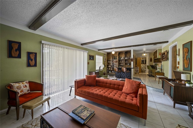 living room with beamed ceiling, light tile patterned flooring, built in features, and a textured ceiling