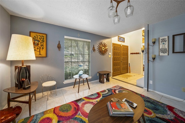 living area with light tile patterned floors and a textured ceiling