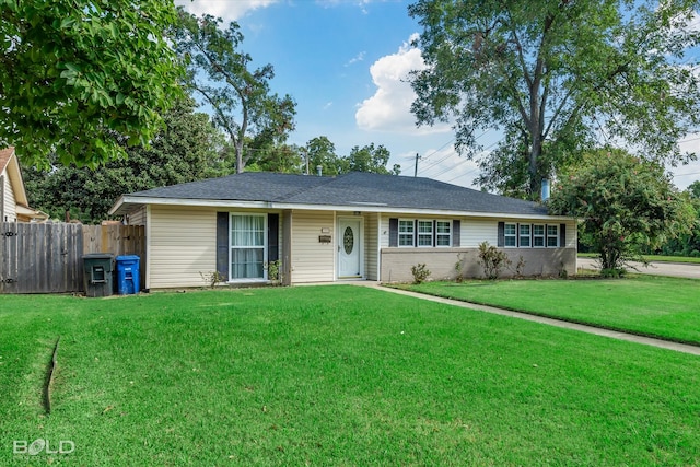 single story home with a front yard