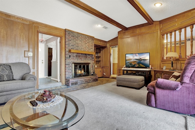 living room featuring a fireplace, wooden walls, lofted ceiling with beams, brick wall, and carpet floors