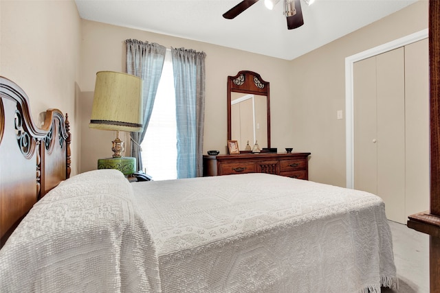 carpeted bedroom with ceiling fan and a closet