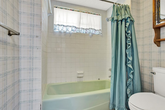 bathroom with toilet and shower / bath combo