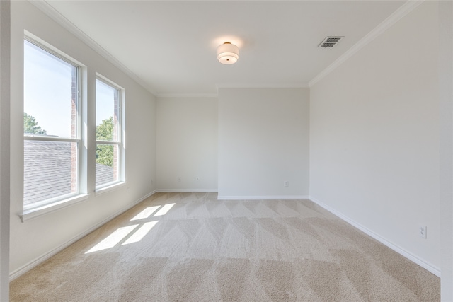 unfurnished room featuring light colored carpet and ornamental molding