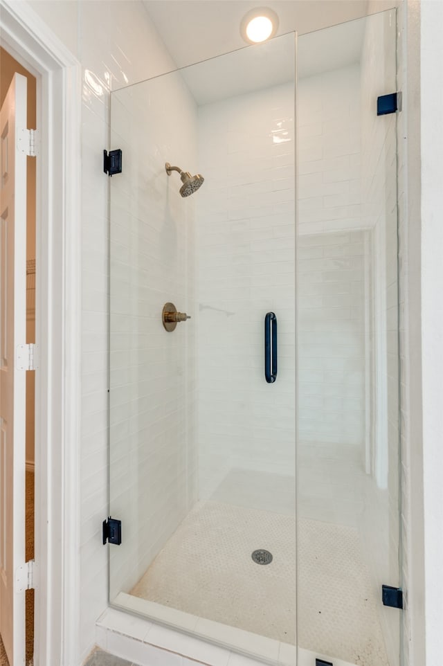 bathroom featuring an enclosed shower