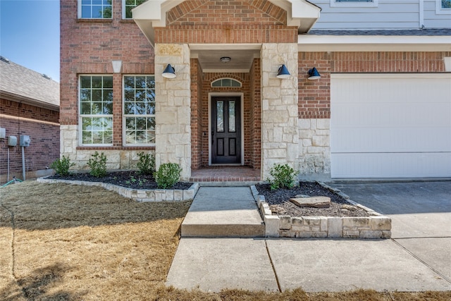 view of exterior entry featuring a garage