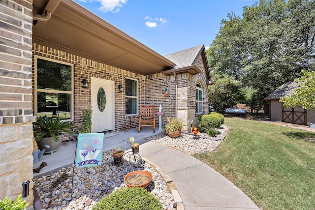 entrance to property featuring a lawn