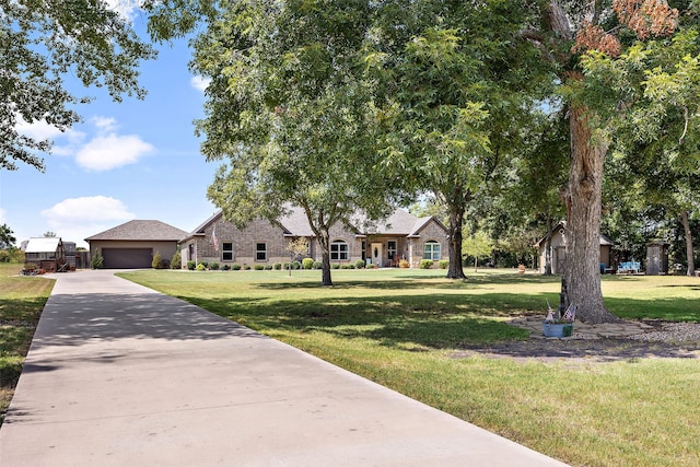 view of front of property with a garage and a front yard