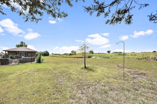 view of yard with a rural view