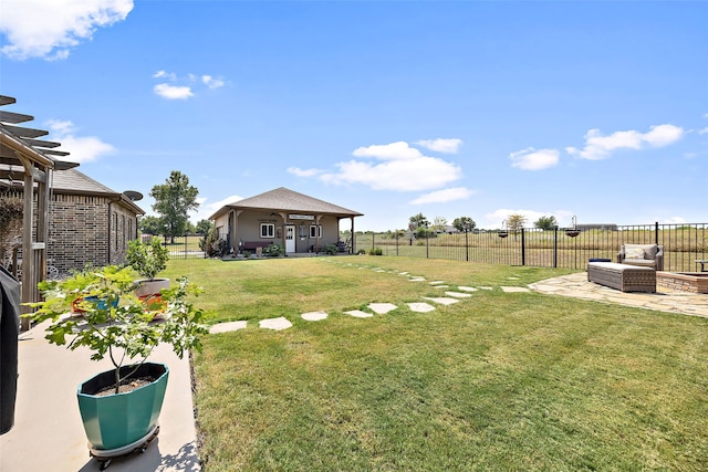 view of yard with an outdoor living space and a patio area