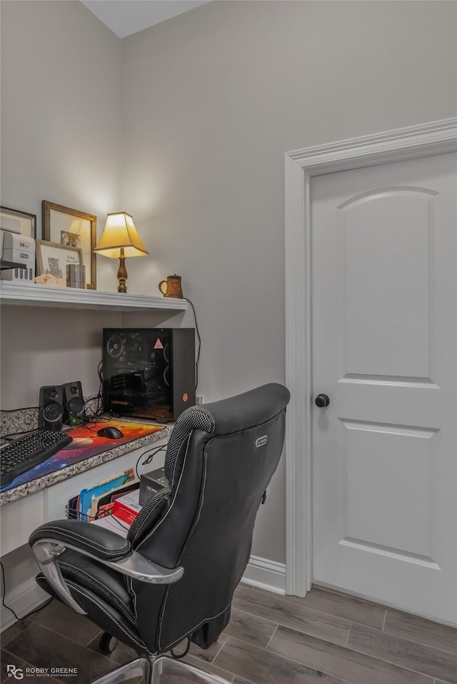 office space featuring wood finish floors and baseboards