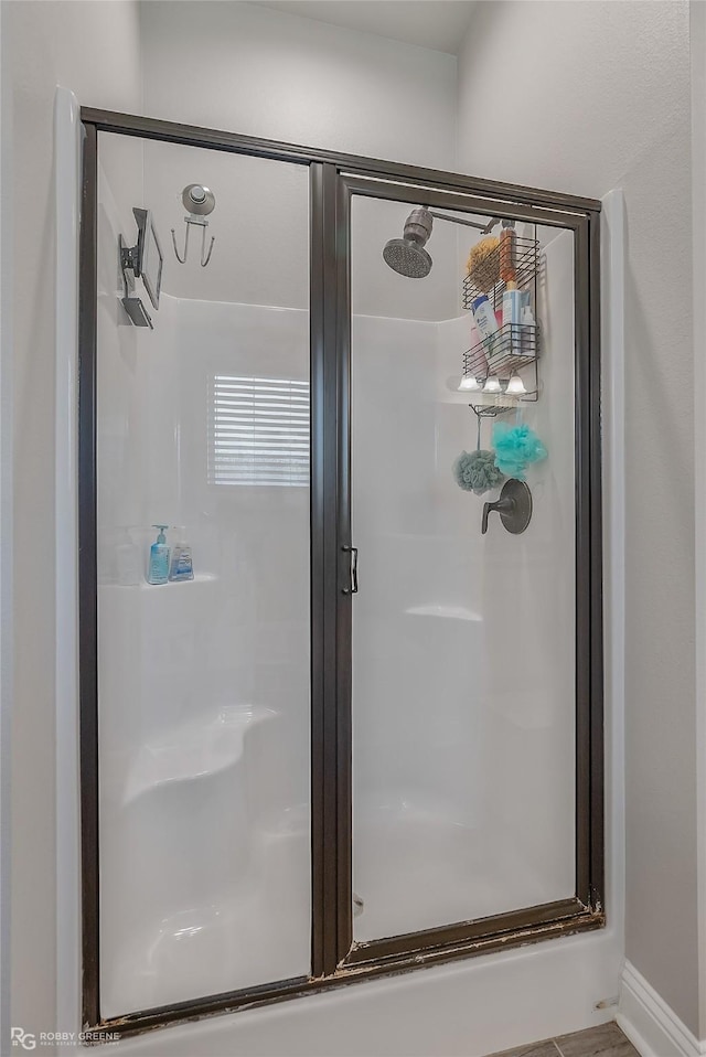 full bathroom featuring a stall shower