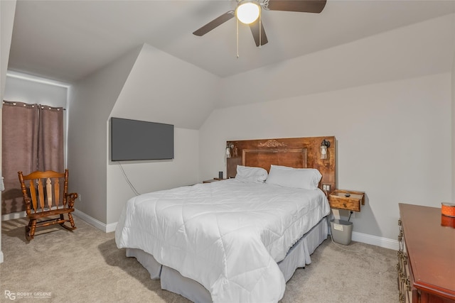 bedroom with a ceiling fan, light carpet, vaulted ceiling, and baseboards