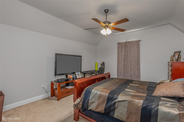 bedroom with lofted ceiling, light carpet, a ceiling fan, and baseboards