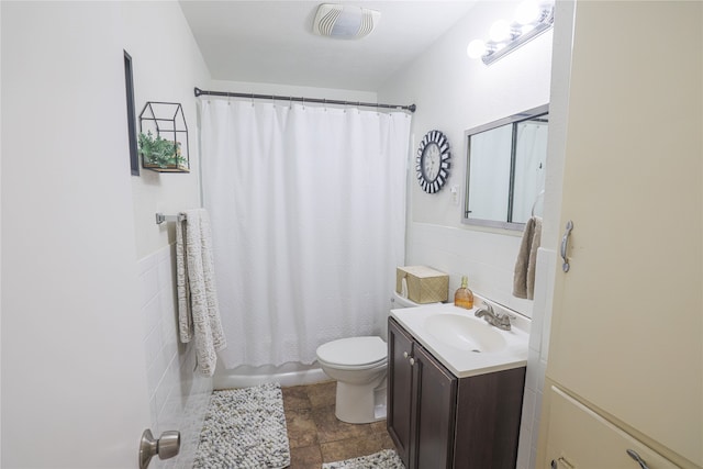 full bathroom with vanity, toilet, shower / bath combination with curtain, and tile patterned floors