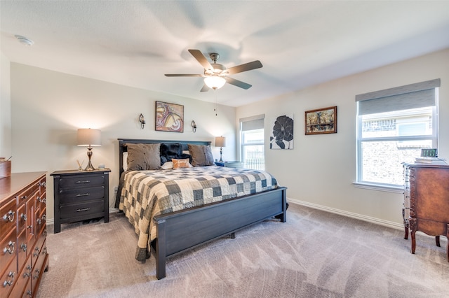 bedroom featuring ceiling fan and light colored carpet