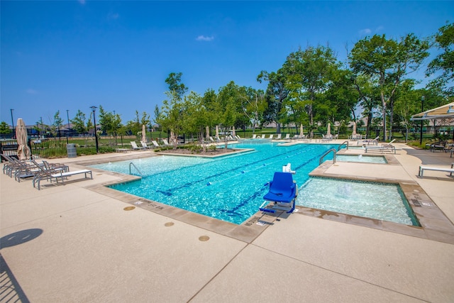 view of swimming pool featuring a patio area