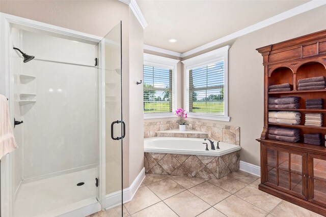 bathroom featuring crown molding, independent shower and bath, and tile patterned floors