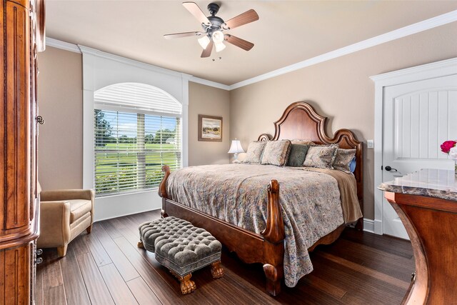 bedroom featuring crown molding, ceiling fan, and dark hardwood / wood-style floors