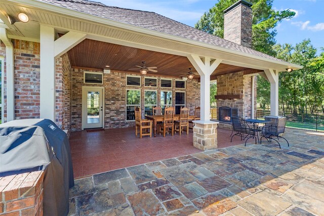 view of patio with grilling area and ceiling fan