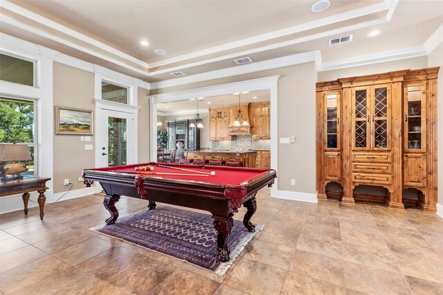 rec room with a tray ceiling, crown molding, and billiards