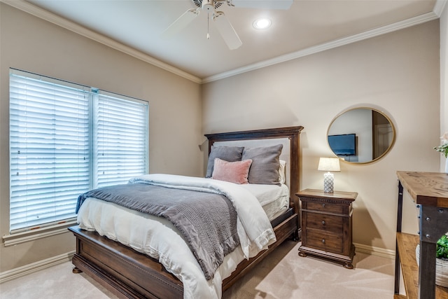 carpeted bedroom with ceiling fan and crown molding