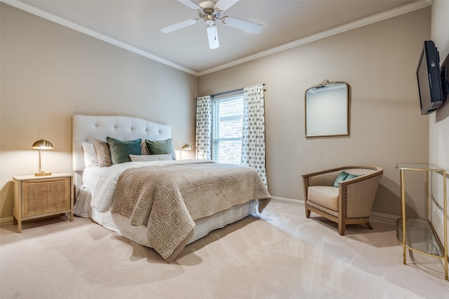 carpeted bedroom with ornamental molding and ceiling fan