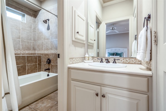 bathroom with vanity, shower / bath combination with curtain, crown molding, ceiling fan, and tile patterned floors