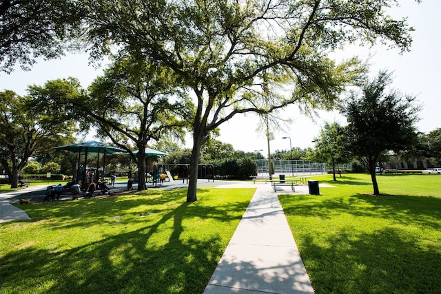 view of property's community with a yard