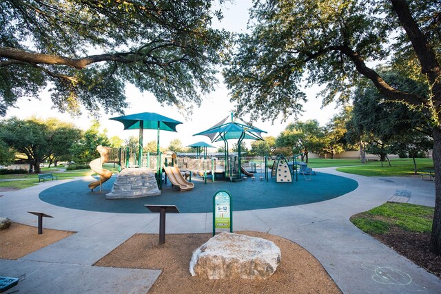 view of jungle gym featuring a lawn