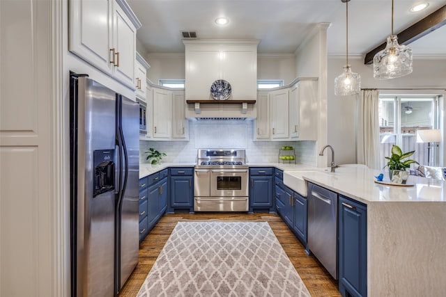 kitchen with blue cabinets, white cabinetry, sink, and stainless steel appliances