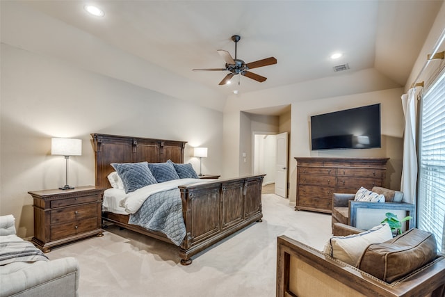 bedroom featuring ceiling fan, light colored carpet, and vaulted ceiling