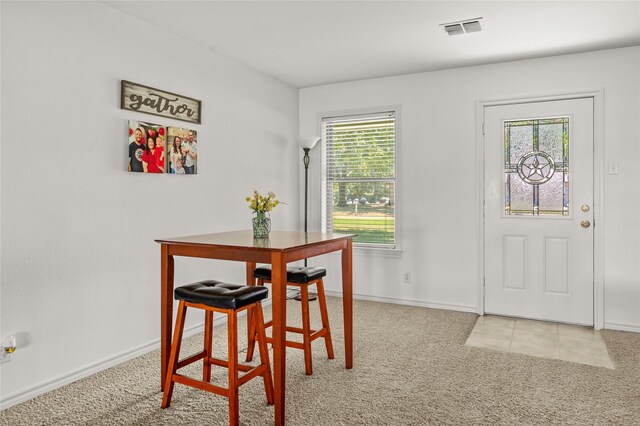 dining area with light carpet